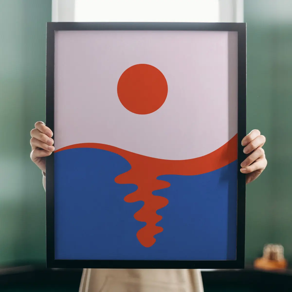 A bold red sun on a lilac sky above a deep blue sea, with a rippling red reflection running down the water